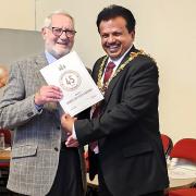 Peter Gardiner received his long service certificate from new mayor Elango Elavalakan