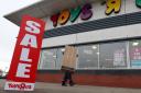 Sale signs outside a Toys R Us store as the company faces filling a �9m pension gap or going into administration by Christmas. Picture: Andrew Matthews/PA Wire