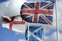 The Flags of  St George, the flag of Scotland and the Great Britain flag fly high in North Northumberland not far from the Scotish Boarders. Owen Humphreys