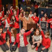 Children from Springfield Junior School were invited for an afternoon of Caribbean culture in Ipswich on Monday. Pictured, the children with Max Thomas of the Ipswich Windrush Society. Image: Charlotte Bond