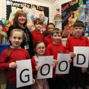 Headteacher Debbie Jackson and pupils celebrate the school’s ‘good’ Ofsted report