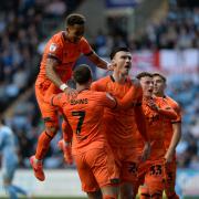 Ipswich Town players celebrate after Kieffer Moore opened the scoring at Coventry City.