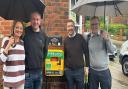 Landlords of the Greyhound with Adie Game and Grant Houlden with a defibrillator