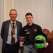 Euan Stephenson receives the Underwood Hardware Junior Sports Personality of the Year award from Felixstowe mayor Seamus Bennett