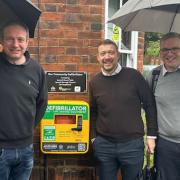 Landlords of the Greyhound with Adie Game and Grant Houlden with a defibrillator