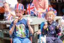 Conor and Niamh tuck into ice creams at the Proms in the Park for the jubilee celebrations.