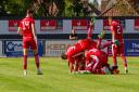 Felixstowe players celebrate Billy Holland's goal from the halfway line against Basildon United