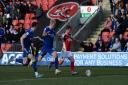 Luke Woolfenden and George Edmundson close down late in the game at Fleetwood Town.