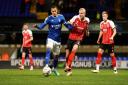 Kayden Jackson battles with Lewis Freestone during Ipswich Town's 0-0 home draw with Cheltenham on Tuesday night.