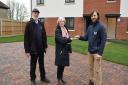 Councillors Jan Osborne, Babergh housing cabinet member and Alastair McCraw ward councillor receive the keys for nine homes on the Brantham housing development from Michael Porter, DCH Construction Contracts Manager.