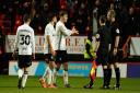 Ipswich Town players speak to the officials after Tuesday night's defeat at Charlton.