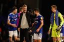 Ipswich Town players George Edmundson (left) and Sam Morsy (right) have a word with Oxford United manager Karl Robinson at the final whistle.