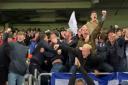 Ipswich Town fans celebrate during their 6-0 win over Doncaster Rovers last night