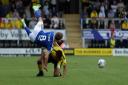 Lee Evans is cleaned out by a challenge from Michael Mancienne at The Pirelli Stadium.