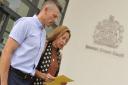 Ian Barker supports his wife Joanne as she read out a statement outside Ipswich Crown Court after a guilty verdict was reached by a jury in the case of optometrist Honey Rose on July 15, 2016.