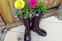 Planting welly boots with flowers is a great way to engage children in gardening  Picture: Ruth Goudy