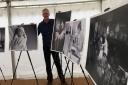 Photographer Warren Page with his exhibition at the Suffolk Show to celebrate 70 years of the NHS   Picture: GEMMA MITCHELL