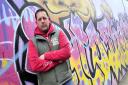 Graffiti artist Scott King who was fined after not clearing up after his dog.