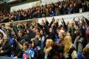 Town fans celebrate at the final whistle.