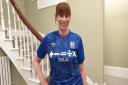 Julie Long, fundraising manager at Suffolk Mind sporting the signed Ipswich Town Football Club shirt.