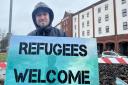 More than 100 people came together outside Ipswich's Novotel to show their support for refugees, chanting: 