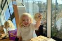 A new nursery has opened in Ravenswood in a former Ipswich Airport building. Pictured: Three-year-old Bella shows that she is feeling happy with 'feeling blocks'. Image: Newsquest