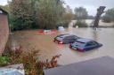 Heavy rain from Storm Babet led to cars being submerged in Framlingham after the town's Mere burst its banks