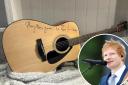A guitar signed by the Suffolk singer-songwriter has gone up for auction