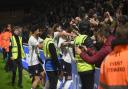Ipswich Town players celebrate with fans at Wycombe Wanderers - there could be almost 7,000 travelling Town fans at MK Dons later this month