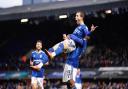 Bersant Celina celebrates his goal just before the break with a lift from team-mate Sone Aluko.