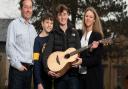 Graham, Henry, Jacob and Kellie Myers with their new guitar from Ed Sheeran.  Picture: Sarah Lucy Brown