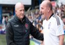 Paul Cook and Simon Grayson at Portman Road yesterday. Fleetwood boss Grayson says his team didn't deserve the 2-1 defeat