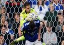 Ipswich keeper Vaclav Hladky climbing over teammate George Edmundson as he makes a second half save