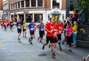 10k runners pass the Giles statue during the Twilight Run. Picture: STEVE WALLER