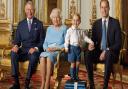 Prince George stands on foam blocks during a Royal Mail photoshoot for a stamp sheet to mark the 90th birthday of Queen Elizabeth II