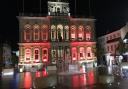 Ipswich Town Hall being lit up red for Remembrance