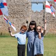 Fynn, Yuki and Edith celebrating Suffolk Day at Framlingham Castle.