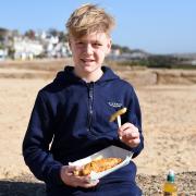 Young lad Luca Brett enjoying a delicious portion of fish and chips from Fish Dish in Felixstowe