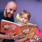 People flocked to The Hold this weekend to meet the rebels from children's books many have known and loved. Pictured: Neil and Rowan Gibson reading Dirty Bertie