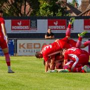 Felixstowe players celebrate Billy Holland's goal from the halfway line against Basildon United