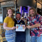The Duke of York was one of just 60 pubs chosen by the music legend for fans to go and have a drink on him to celebrate his birthday. Left to Right: Bar manager, Hannah Creed, Yatt Van Da Bronckhorst and Owner Chris Mapey