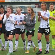 Ipswich Town Women players applaud the travelling fans