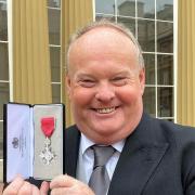 Mark Murphy was presented with his MBE at Buckingham Palace.
