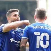 Remember the name: Skipper Sam Morsy points to James Norwoods name on his shirt after the outgoing player had stepped off the bench to score.
