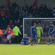 Ipswich Town players look dejected after Crewe snatched a late equaliser yesterday. The game ended 1-1.