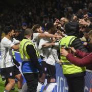 Ipswich Town players celebrate with fans at Wycombe Wanderers - there could be almost 7,000 travelling Town fans at MK Dons later this month