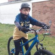 Jack Johnson, 10 from Brantham, will be cycling 100 miles over the next month to raise money for guide dogs