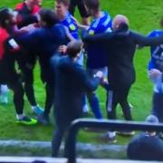 Ipswich Town's Dominic Thompson, right, and Portsmouth boss Danny Cowley were separated after a clash as Thompson tried to take a throw-in yesterday