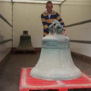 Tower captain Paul Corbett with one of the bells from Barham Church as they were removed for restoration. The bells are all now back in the church