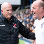 Paul Cook and Simon Grayson at Portman Road yesterday. Fleetwood boss Grayson says his team didn't deserve the 2-1 defeat